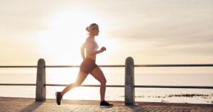 Image of person running by the water.